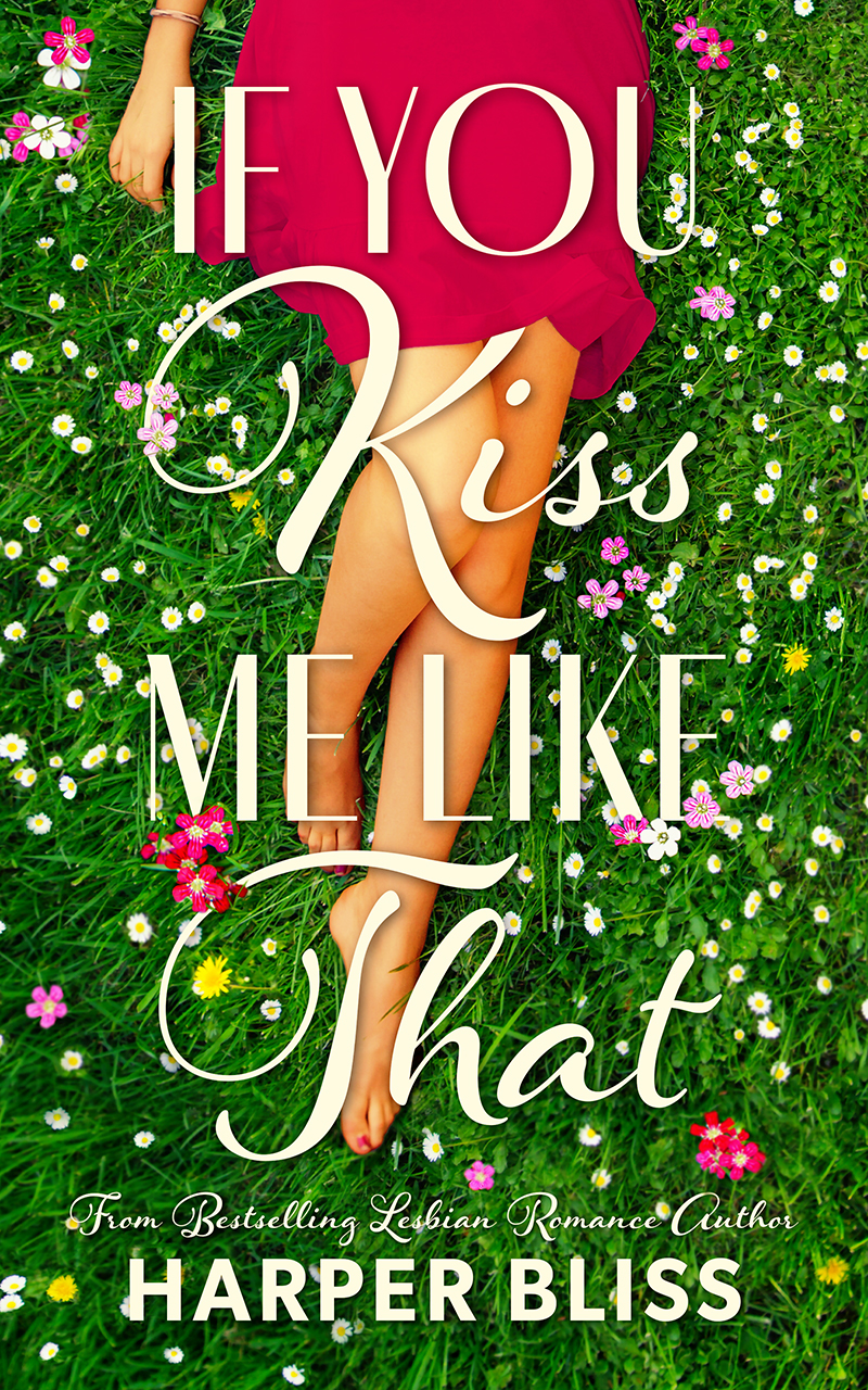 Book cover of If You Kiss Me Like That by Harper Bliss, featuring a woman in a red dress lying on green grass surrounded by colorful wildflowers, with her legs crossed. The title is displayed in elegant white script, evoking romance and charm.